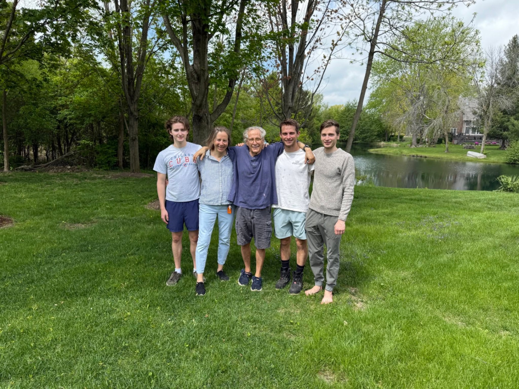 Pierre with his family beside a pond in Chicagoland.